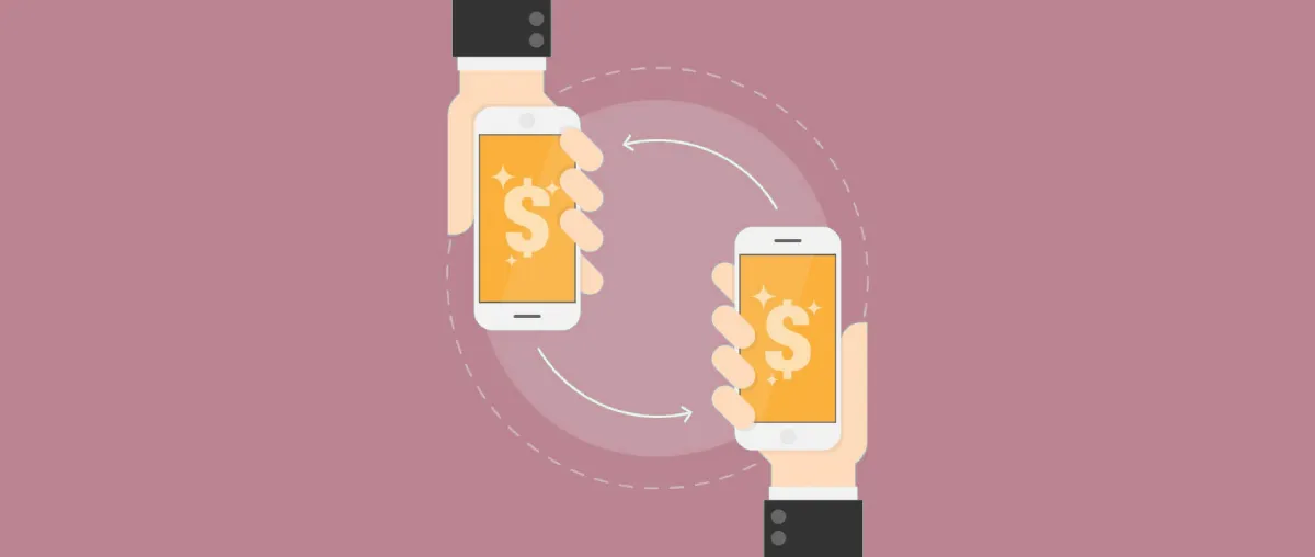 duas mãos segurando celulares com app de transferência de banco digital com PIX
