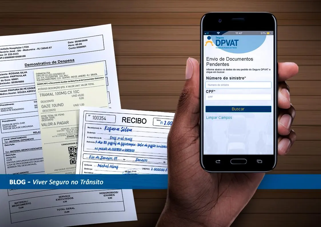 Papéis ao fundo e um celular com a página inicial do aplicativo DPVAT