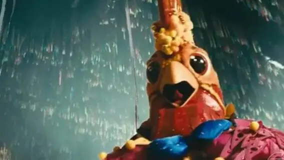 Xamã é desmascarado como Galo do Masked Singer