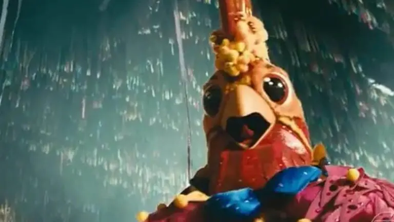 Xamã é desmascarado como Galo do Masked Singer